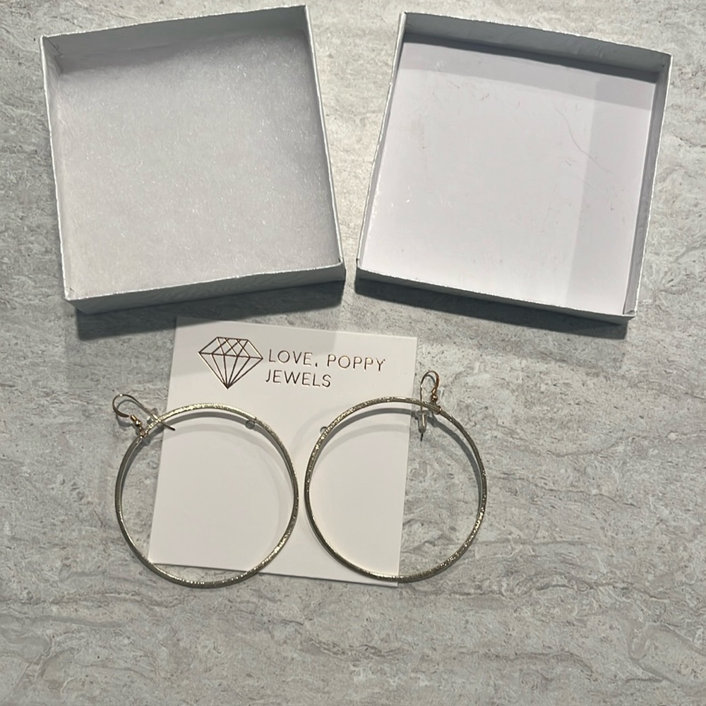 New in box Love Poppy earrings